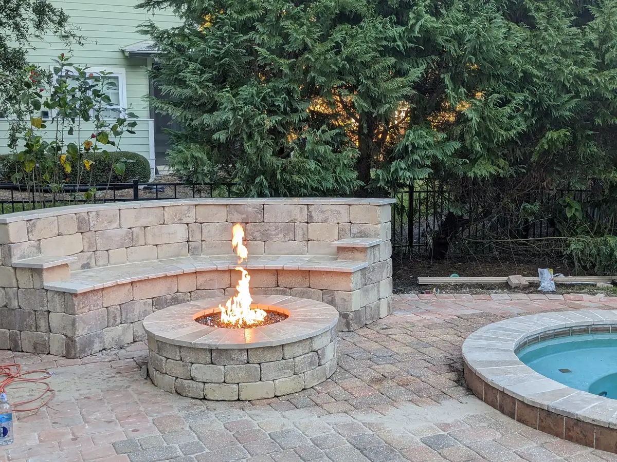 Fire pit installation with natural stone surround in Northeast Florida