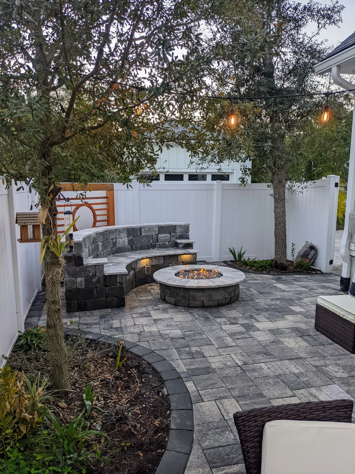 Backyard fire pit and patio design by Bloom and Stone Outdoor Designs
