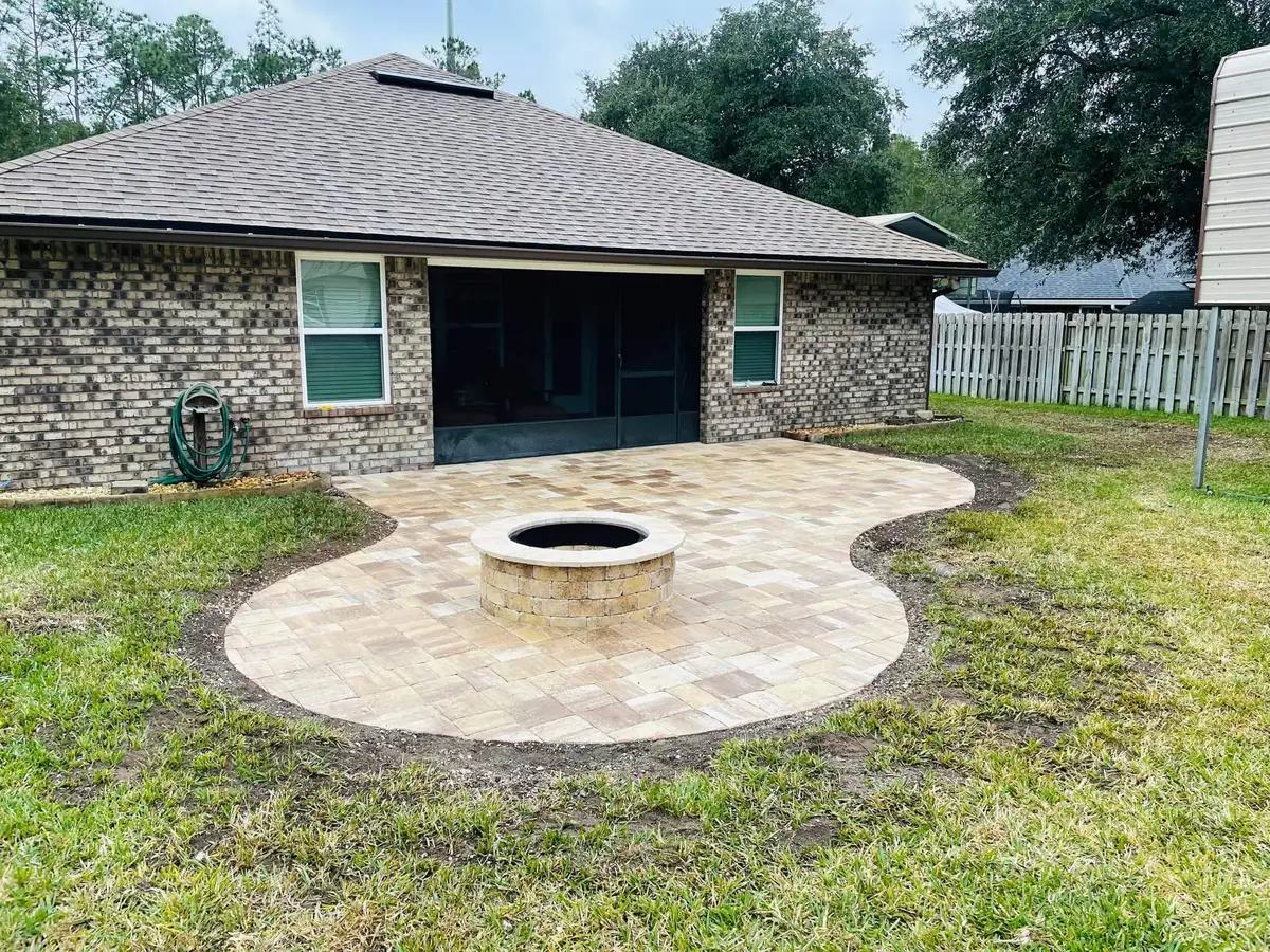 Natural stone fire pit with built-in seating in Fernandina Beach