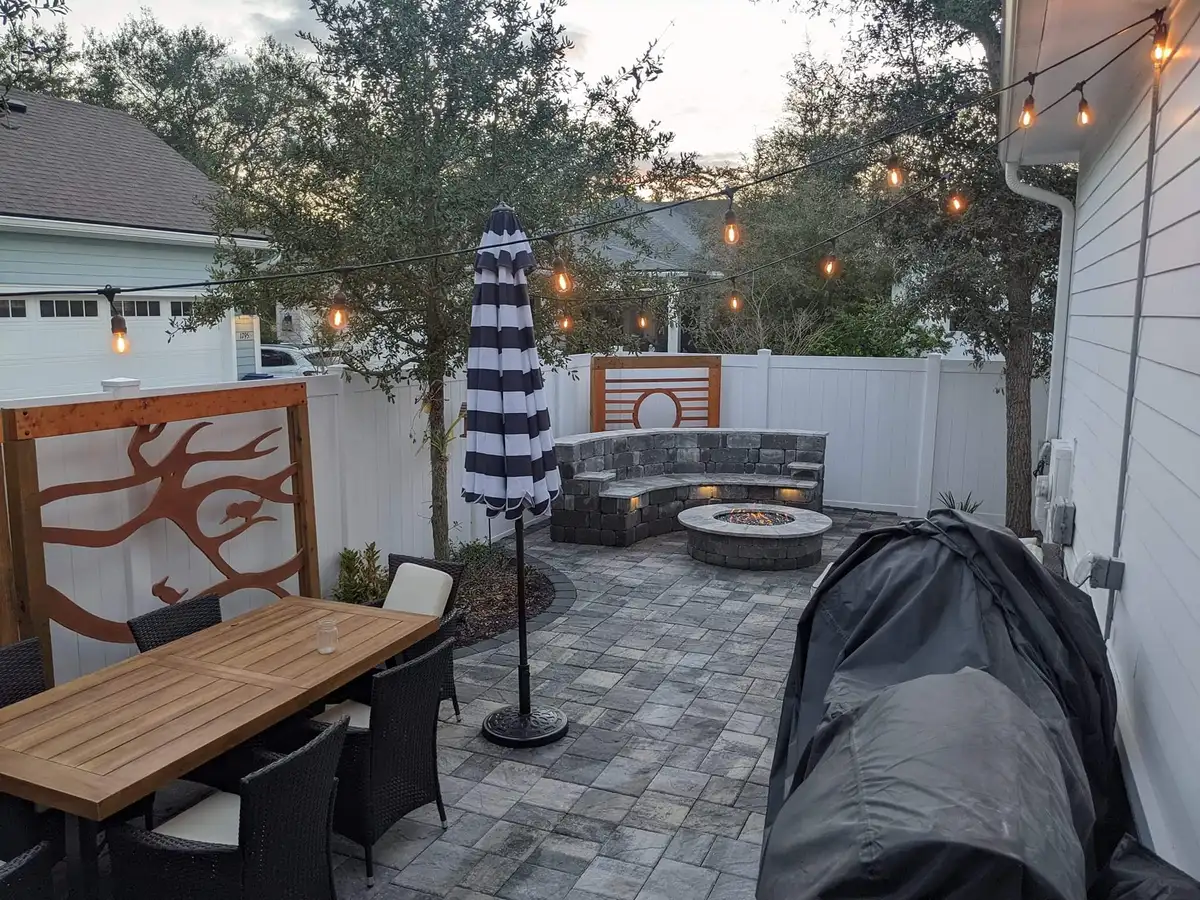 Custom stone patio with naturalistic plantings in Fernandina Beach