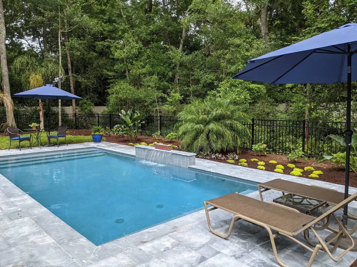 Custom natural stone retaining wall installed by Bloom and Stone in Northeast Florida
