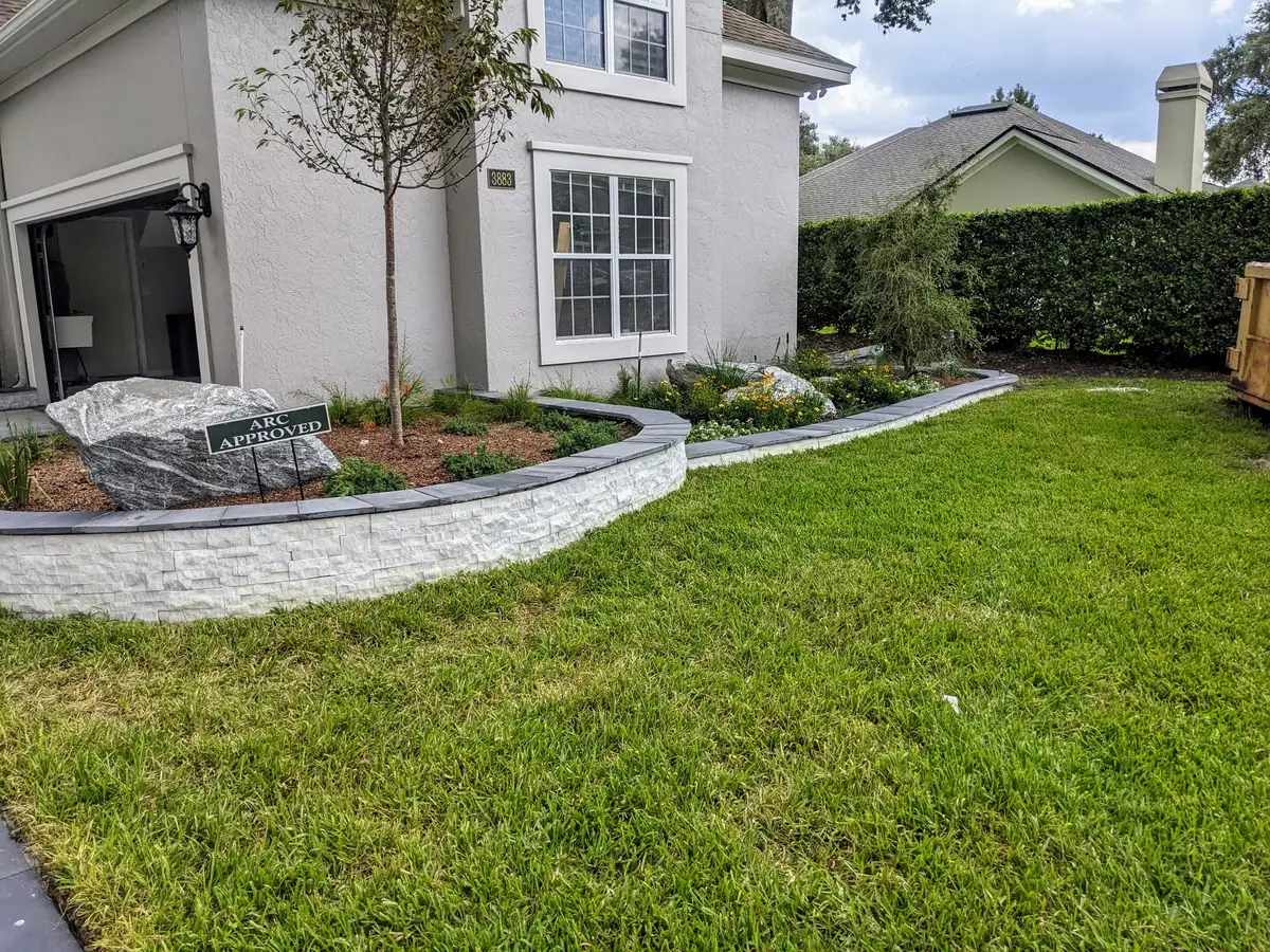 Landscape lighting illuminating outdoor living area at dusk