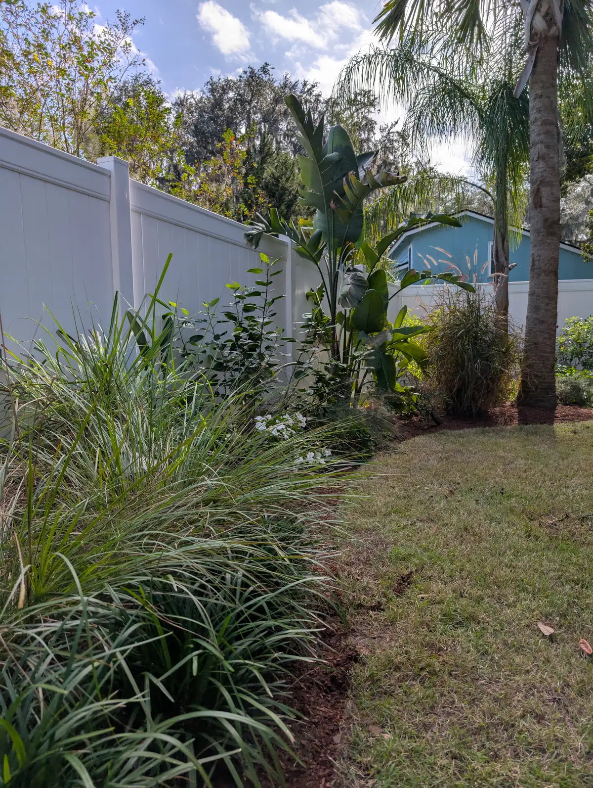 Outdoor dining area with pergola and landscape lighting