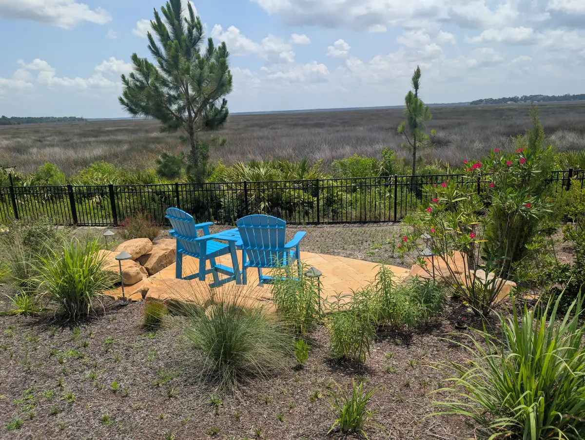 Natural stone seating terrace overlooking a coastal marsh